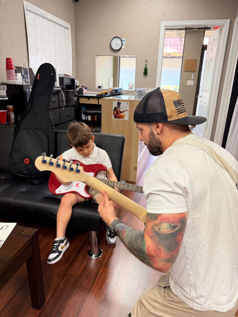 student learning drums with instructor in Coral Springs music school