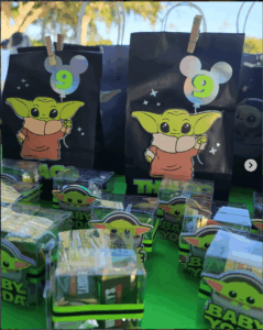Personalized Grogu-inspired birthday party favors featuring custom gift bags, treat boxes, and themed decorations created by FloreSer for children's birthday celebrations